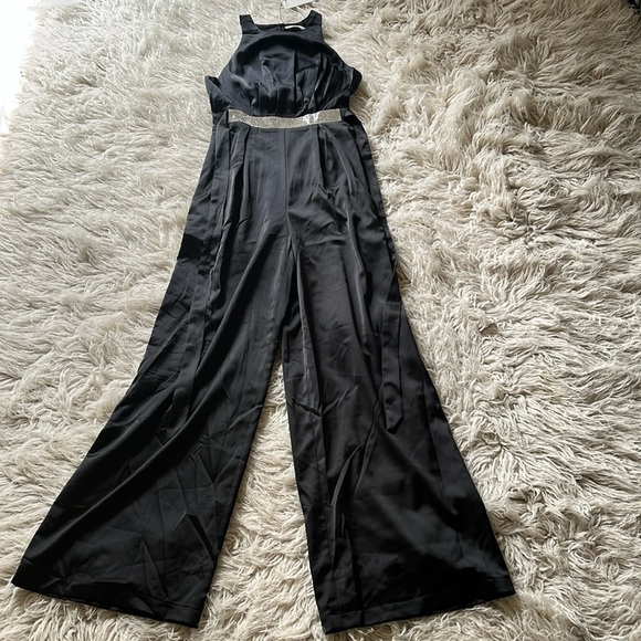 Mustard Seed Pants - 4/$22 NWT Mustard Seed black sleeveless jewel attached tie belt pleated jumpsuit